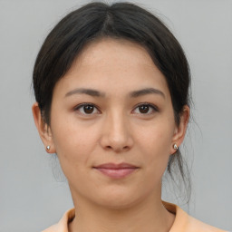 Joyful asian young-adult female with medium  brown hair and brown eyes