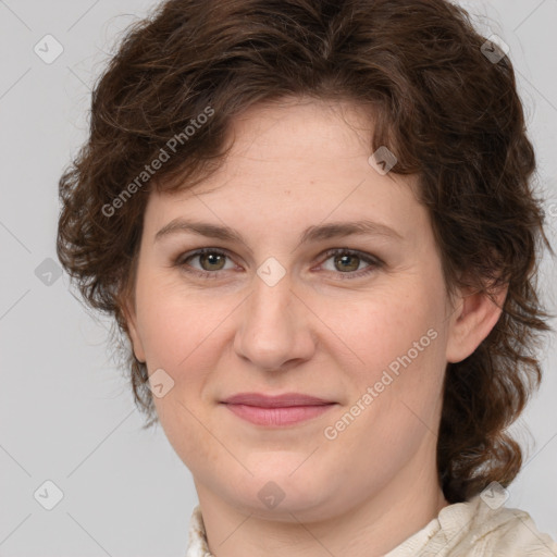 Joyful white young-adult female with medium  brown hair and green eyes