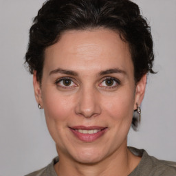 Joyful white adult female with short  brown hair and brown eyes