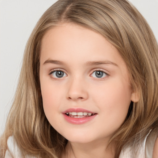 Joyful white child female with medium  brown hair and brown eyes