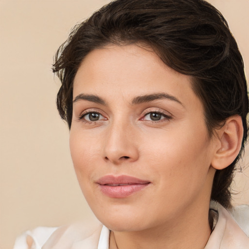 Joyful white young-adult female with medium  brown hair and brown eyes