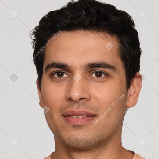 Joyful white young-adult male with short  black hair and brown eyes