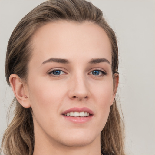 Joyful white young-adult female with long  brown hair and grey eyes