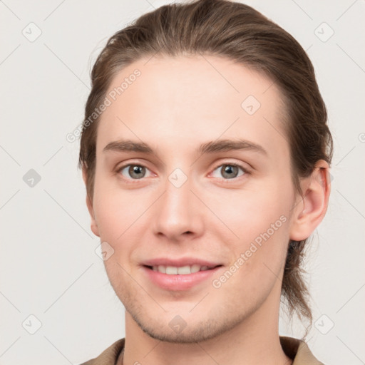 Joyful white young-adult female with short  brown hair and grey eyes