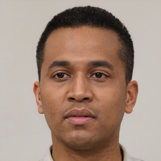 Neutral latino young-adult male with short  black hair and brown eyes