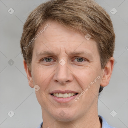 Joyful white adult male with short  brown hair and grey eyes