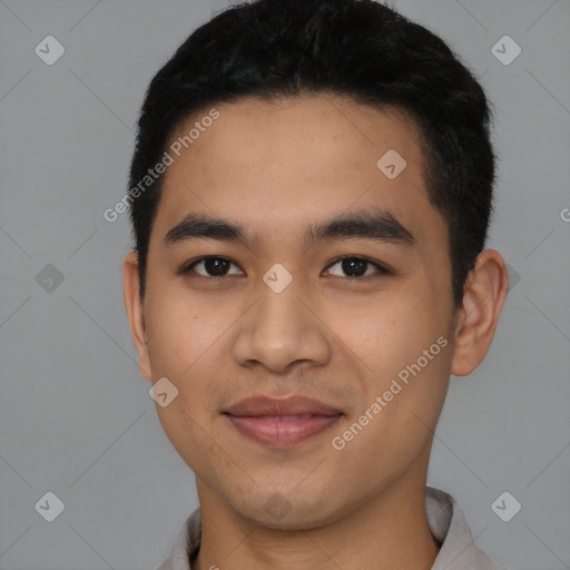 Joyful latino young-adult male with short  black hair and brown eyes