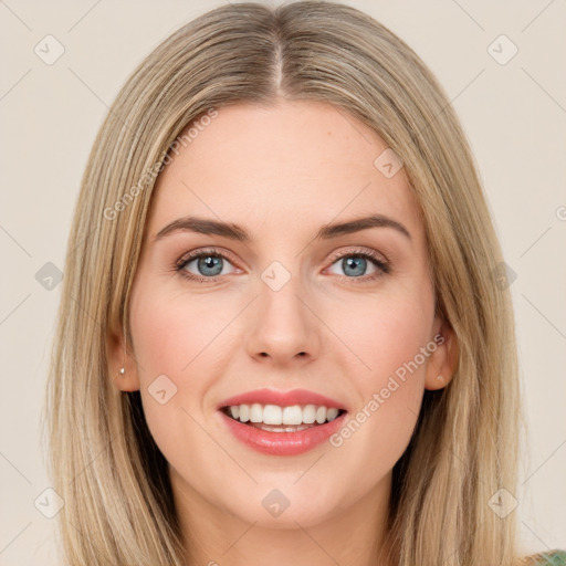 Joyful white young-adult female with long  brown hair and green eyes