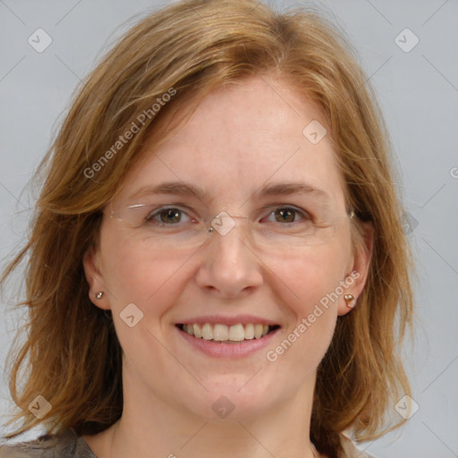 Joyful white adult female with medium  brown hair and blue eyes