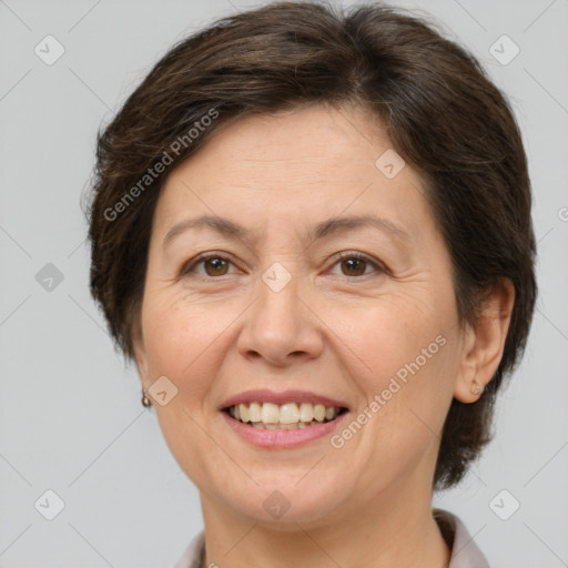 Joyful white adult female with medium  brown hair and brown eyes