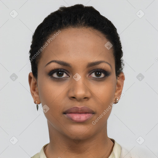 Joyful black young-adult female with short  black hair and brown eyes