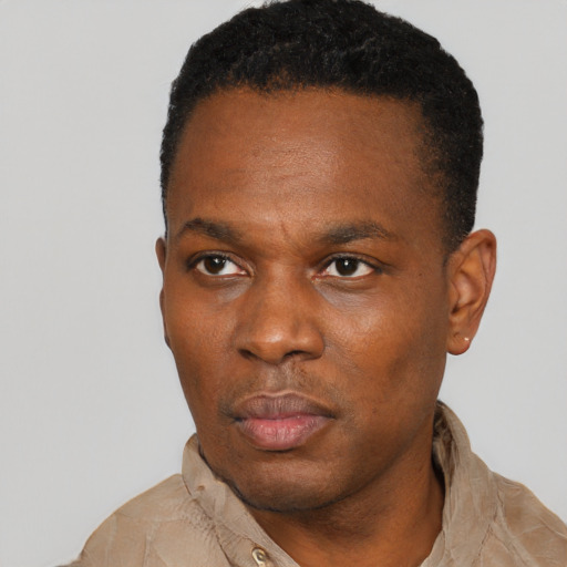 Neutral black adult male with short  black hair and brown eyes