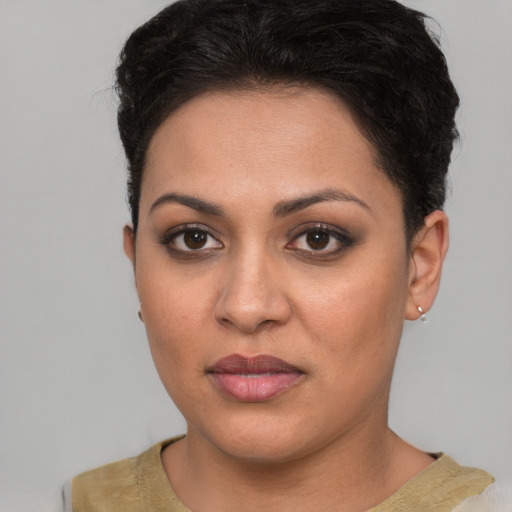 Joyful white young-adult female with short  brown hair and brown eyes