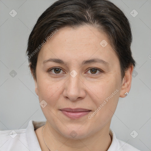 Joyful white adult female with short  brown hair and brown eyes