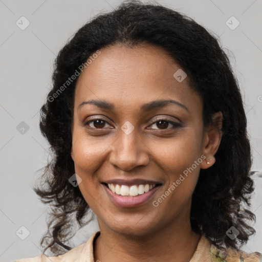 Joyful black young-adult female with long  brown hair and brown eyes