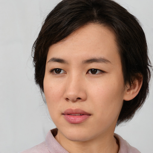 Neutral asian young-adult female with medium  brown hair and brown eyes