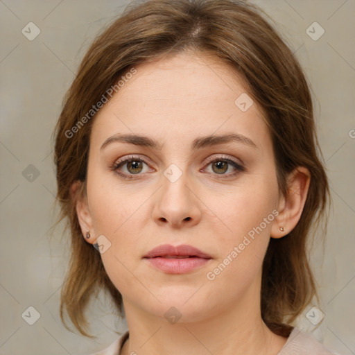 Joyful white young-adult female with medium  brown hair and green eyes