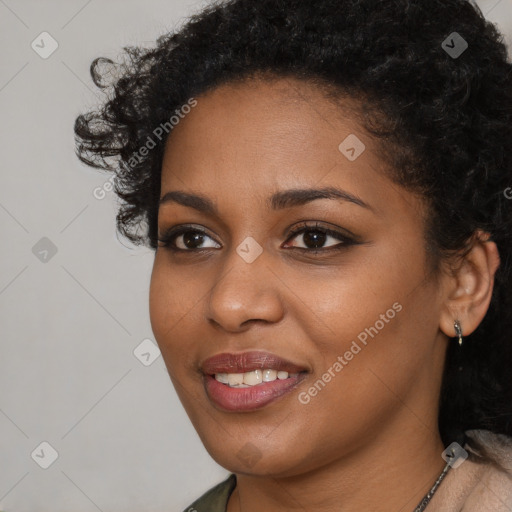 Joyful black young-adult female with short  brown hair and brown eyes