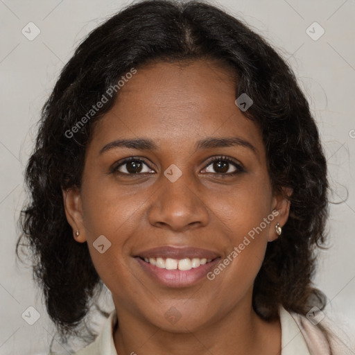 Joyful black young-adult female with medium  brown hair and brown eyes