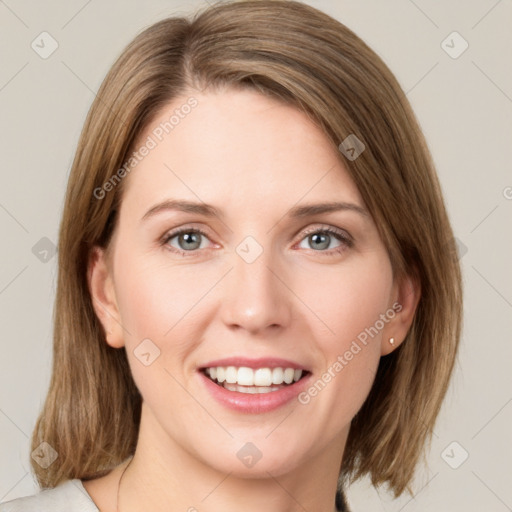 Joyful white young-adult female with medium  brown hair and green eyes