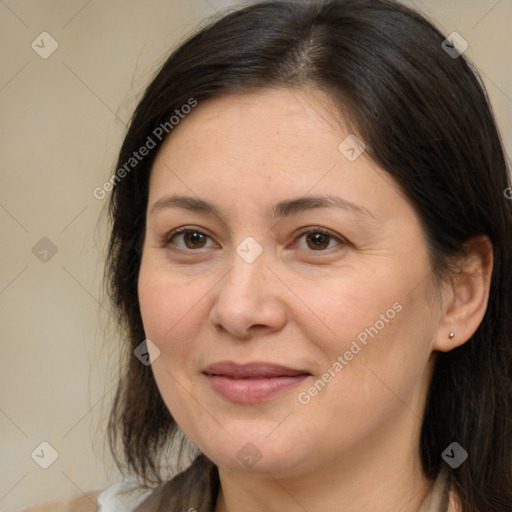 Joyful white adult female with medium  brown hair and brown eyes