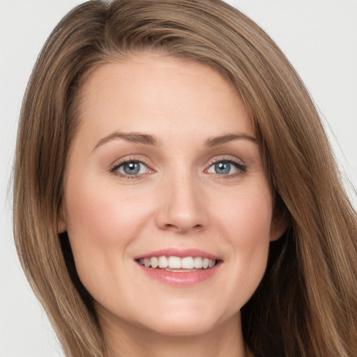 Joyful white young-adult female with long  brown hair and grey eyes