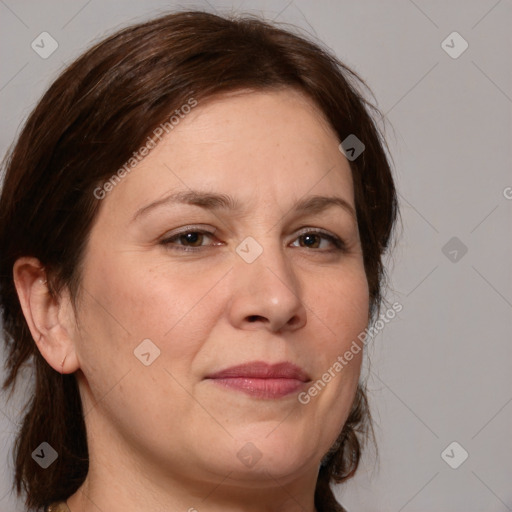 Joyful white adult female with medium  brown hair and brown eyes