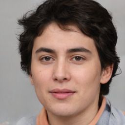 Joyful white young-adult male with medium  brown hair and brown eyes