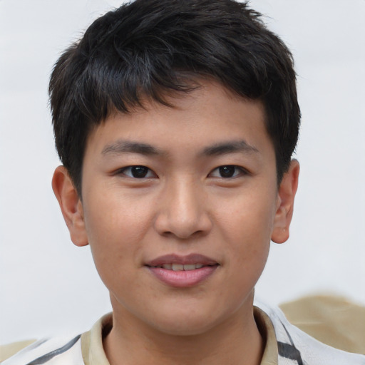 Joyful asian young-adult male with short  brown hair and brown eyes