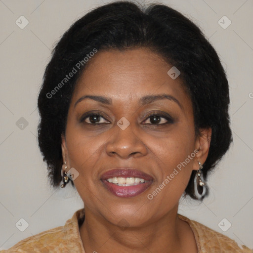 Joyful black adult female with medium  brown hair and brown eyes