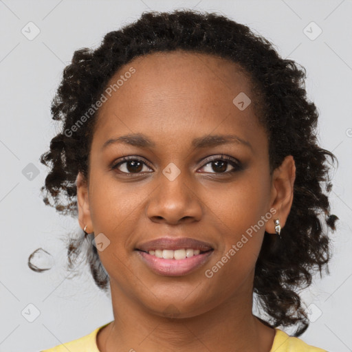 Joyful black young-adult female with medium  brown hair and brown eyes