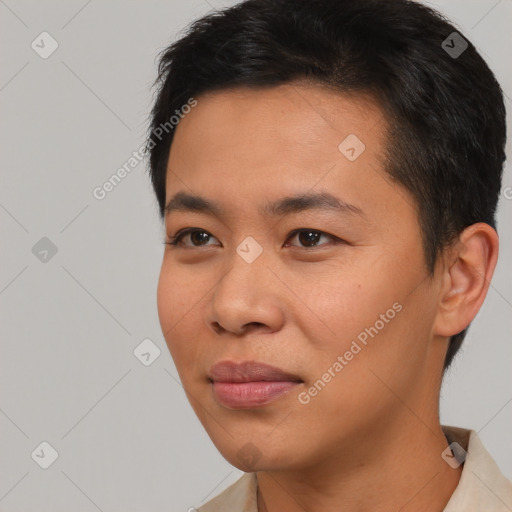 Joyful asian young-adult male with short  black hair and brown eyes