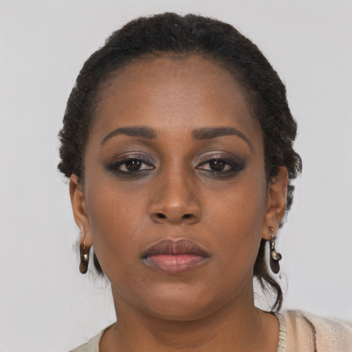 Neutral black young-adult female with short  brown hair and brown eyes