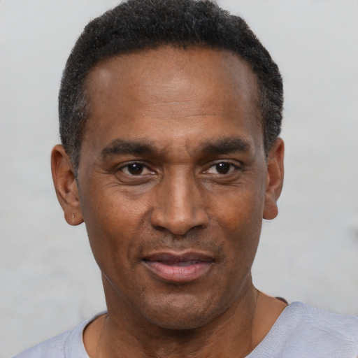 Neutral latino adult male with short  black hair and brown eyes