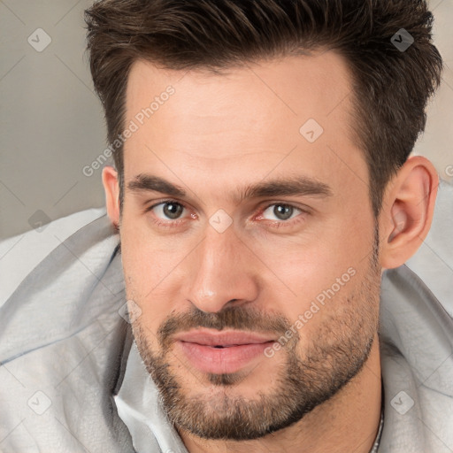 Joyful white adult male with short  brown hair and brown eyes