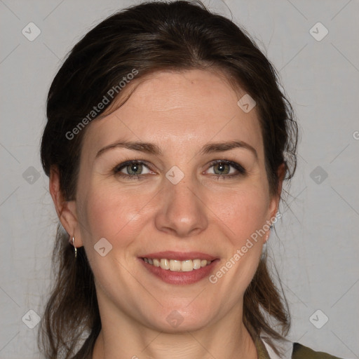 Joyful white adult female with medium  brown hair and grey eyes