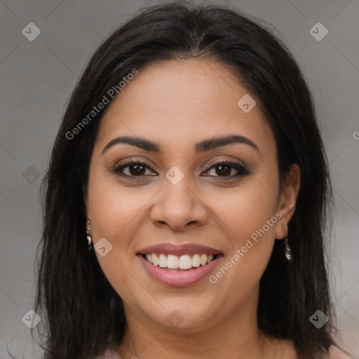 Joyful latino young-adult female with long  brown hair and brown eyes