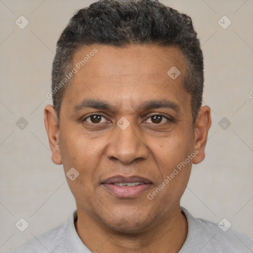 Joyful white adult male with short  black hair and brown eyes