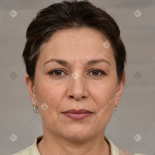 Joyful white adult female with short  brown hair and brown eyes