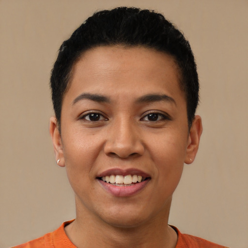 Joyful latino young-adult female with short  black hair and brown eyes
