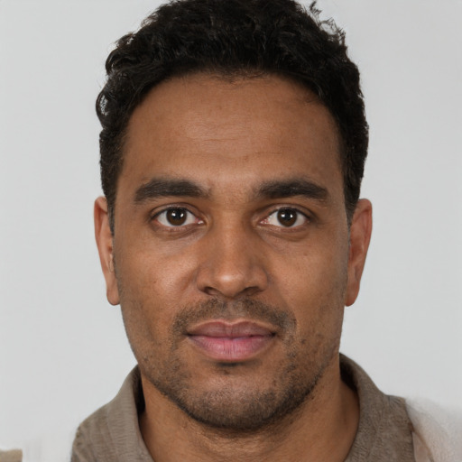Neutral black young-adult male with short  black hair and brown eyes
