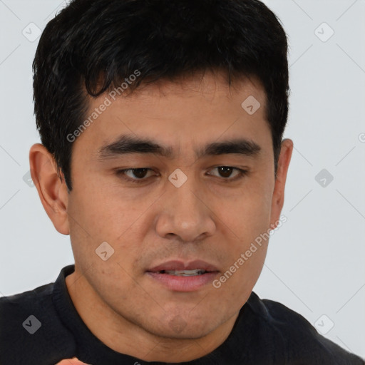 Joyful asian young-adult male with short  brown hair and brown eyes