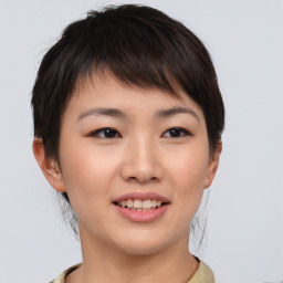 Joyful asian young-adult female with short  brown hair and brown eyes