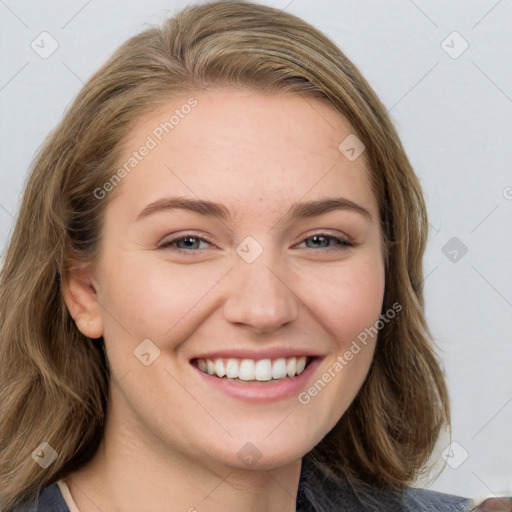 Joyful white young-adult female with medium  brown hair and blue eyes