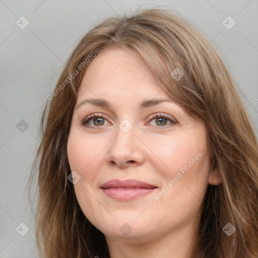 Joyful white young-adult female with long  brown hair and green eyes