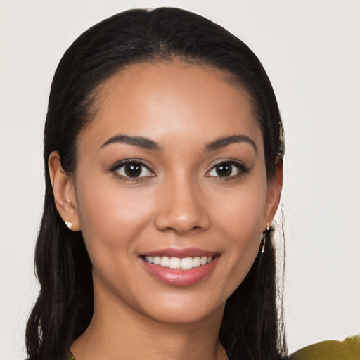 Joyful latino young-adult female with long  brown hair and brown eyes