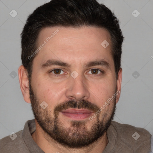 Joyful white adult male with short  brown hair and brown eyes