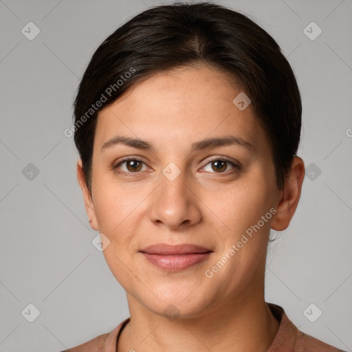 Joyful white young-adult female with short  brown hair and grey eyes