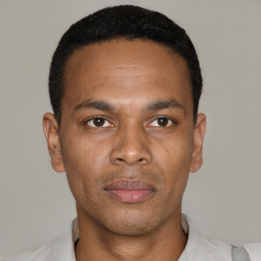 Neutral black young-adult male with short  black hair and brown eyes