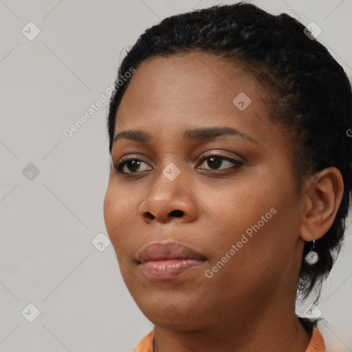 Neutral black young-adult female with short  black hair and brown eyes